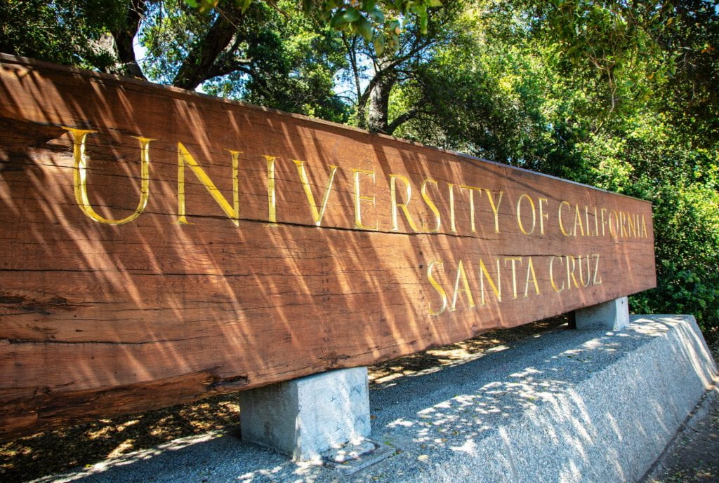 Redwood sign at the base of campus that reads University of California Santa Cruz